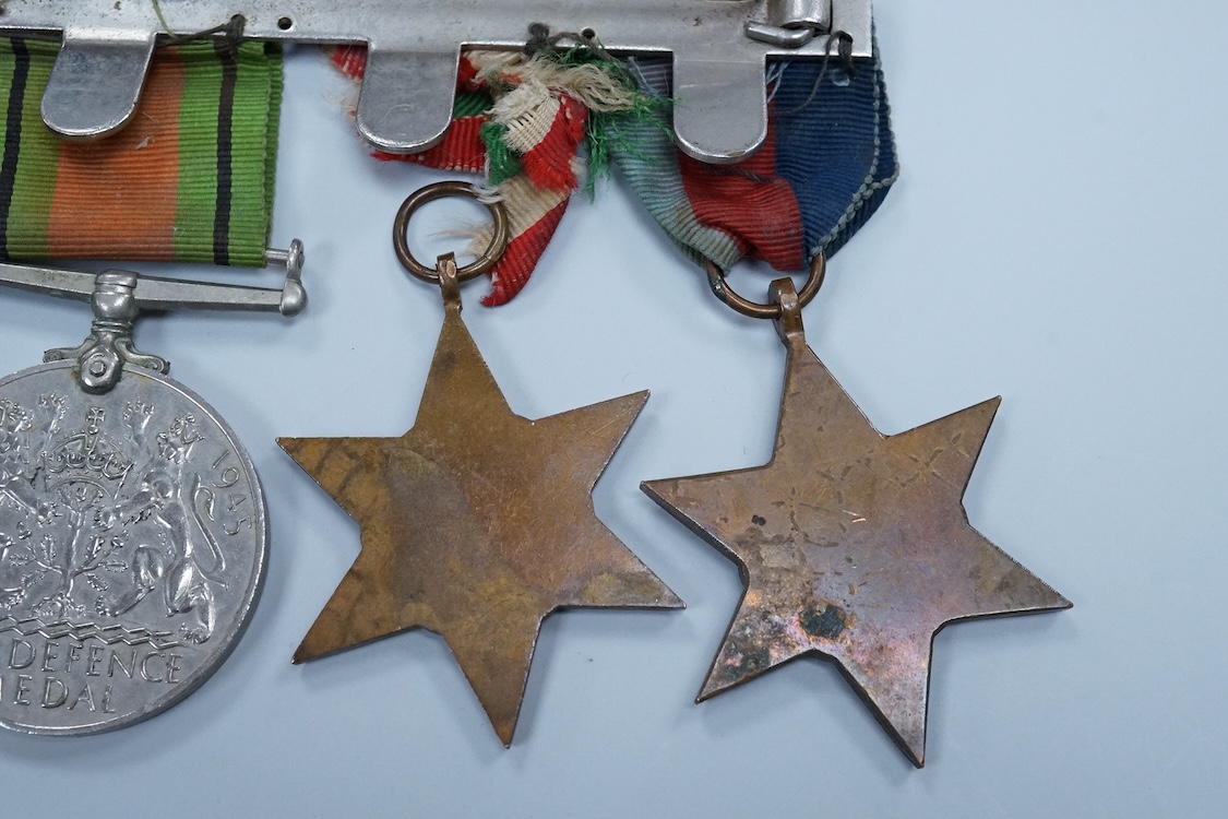A WWII medal group awarded to Fg. Off. A.J. Fransella R.A.F., comprising of five medals including the Defence Medal, the 1939-1945 Medal, the Italy Star, the 1939-1945 Star and the General Service Medal with clasp for Pa